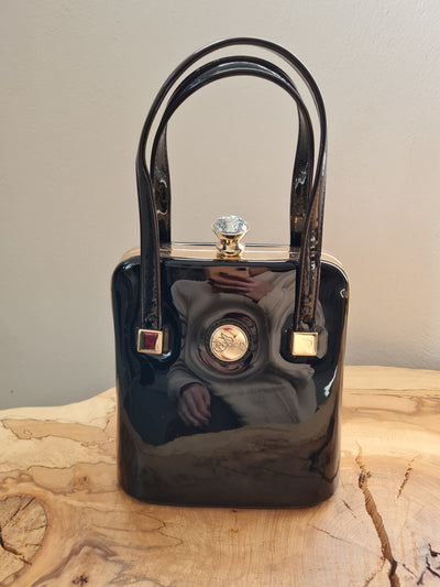 Peach black patent handbag